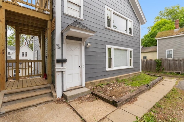 doorway to property with fence