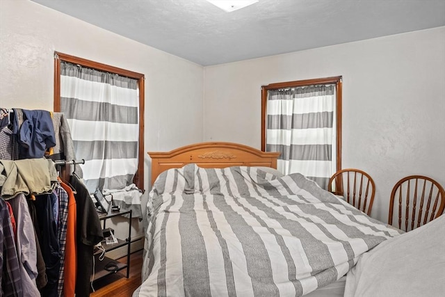 bedroom featuring wood finished floors