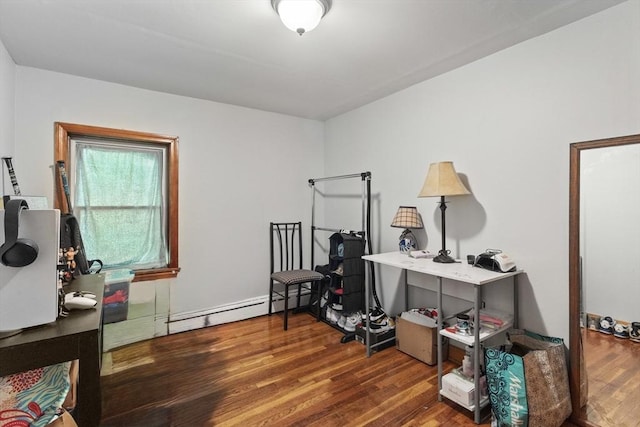 miscellaneous room with a baseboard radiator, wood finished floors, and an office area