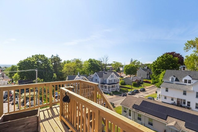 wooden deck with a residential view