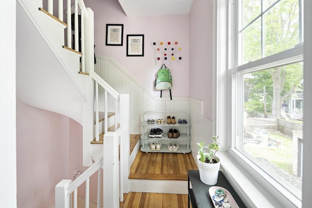 49 Prince St Unit 2, Boston, MA 02130 - staircase featuring wainscoting and wood finished floors