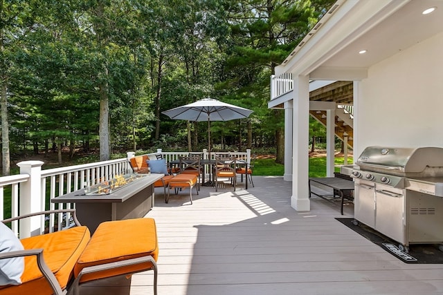 wooden terrace featuring grilling area