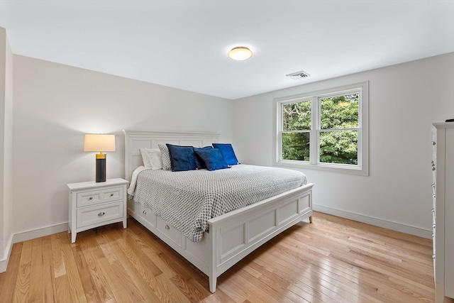 bedroom with light hardwood / wood-style floors