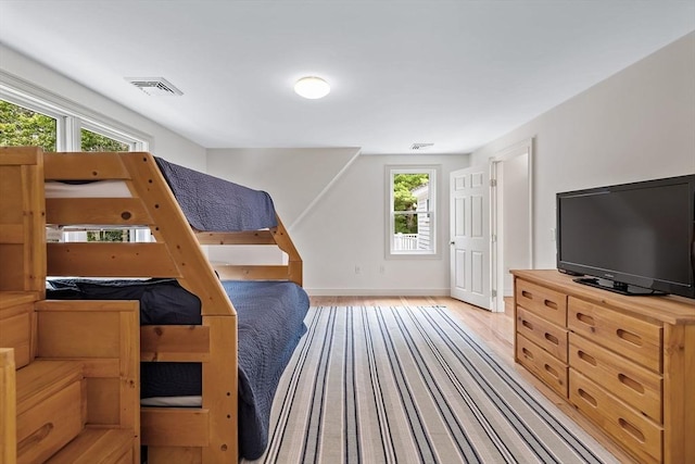 bedroom with light hardwood / wood-style flooring