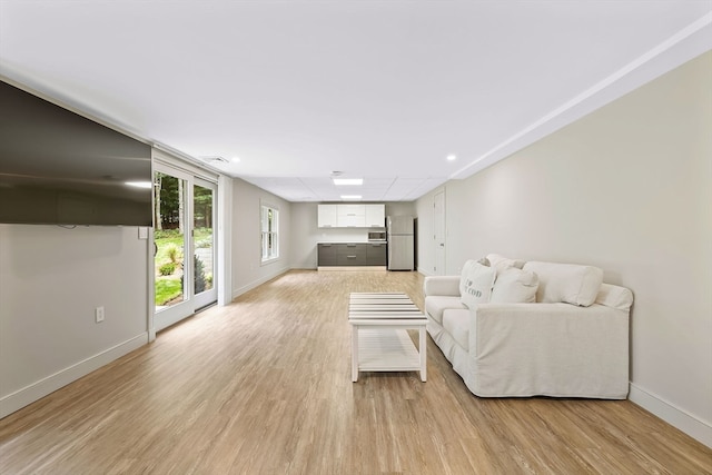 living room with light hardwood / wood-style floors