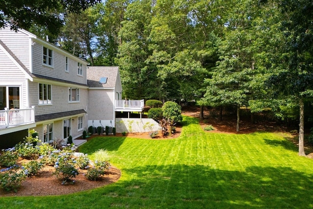 view of yard featuring a wooden deck