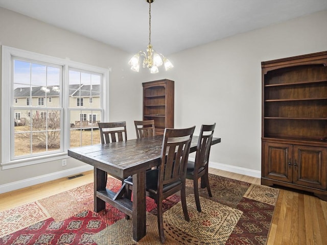 36 Knowlton Cir Unit 36, Upton, MA 01568 - dining space featuring a chandelier and wood finished floors
