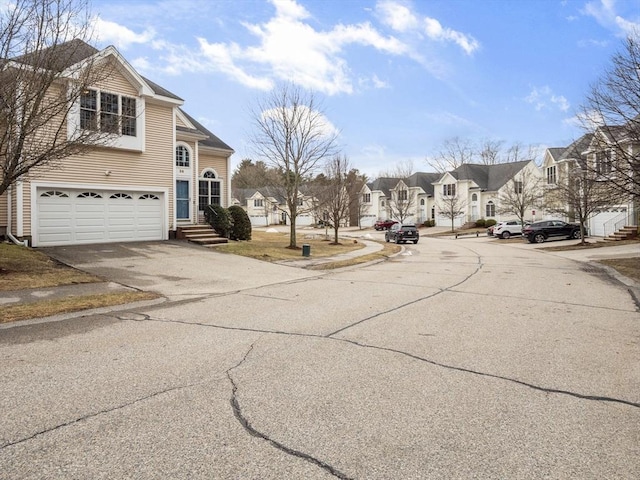 36 Knowlton Cir Unit 36, Upton, MA 01568 - view of asphalt road featuring a residential view, sidewalks, and curbs
