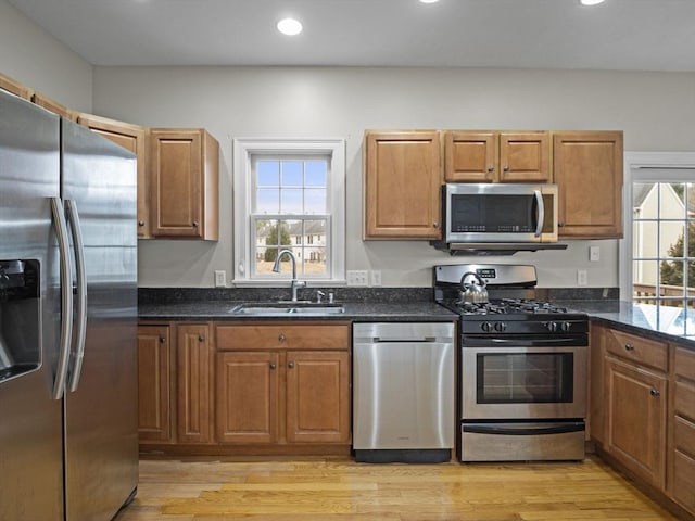 36 Knowlton Cir Unit 36, Upton, MA 01568 - kitchen featuring stainless steel appliances, light wood finished floors, brown cabinets, and recessed lighting
