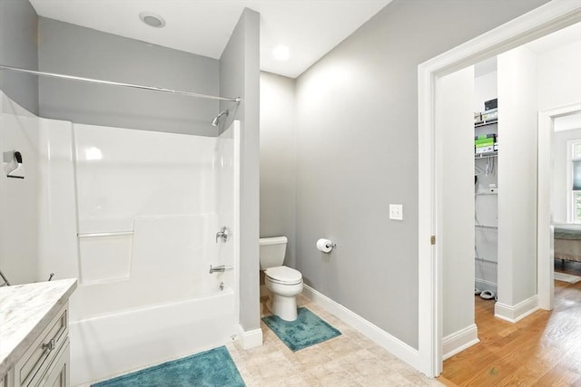 11 High Pine Cir Unit 11, Wilbraham, MA 01095 - bathroom featuring toilet, washtub / shower combination, vanity, baseboards, and recessed lighting