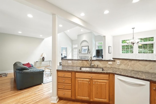 11 High Pine Cir Unit 11, Wilbraham, MA 01095 - kitchen featuring dishwasher, a sink, dark stone counters, open floor plan, and light wood-style flooring