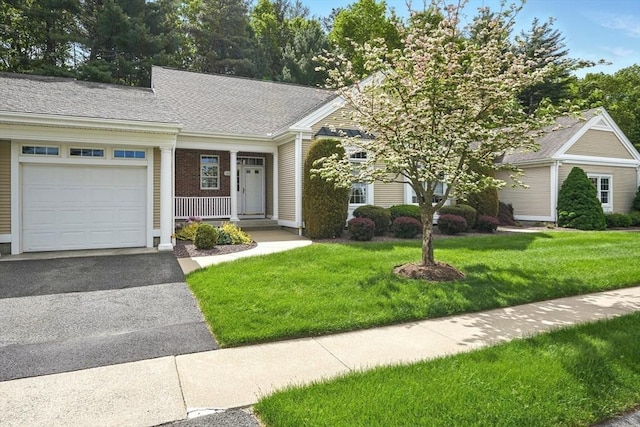 11 High Pine Cir Unit 11, Wilbraham, MA 01095 - view of front of property featuring a garage, a front yard, asphalt driveway, covered porch, and roof with shingles