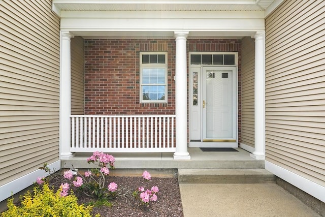 11 High Pine Cir Unit 11, Wilbraham, MA 01095 - view of exterior entry with covered porch and brick siding