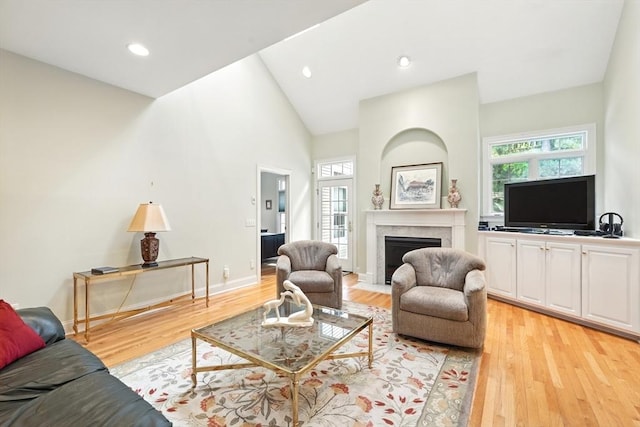 11 High Pine Cir Unit 11, Wilbraham, MA 01095 - living room featuring plenty of natural light, light wood-type flooring, a fireplace with flush hearth, recessed lighting, and high vaulted ceiling