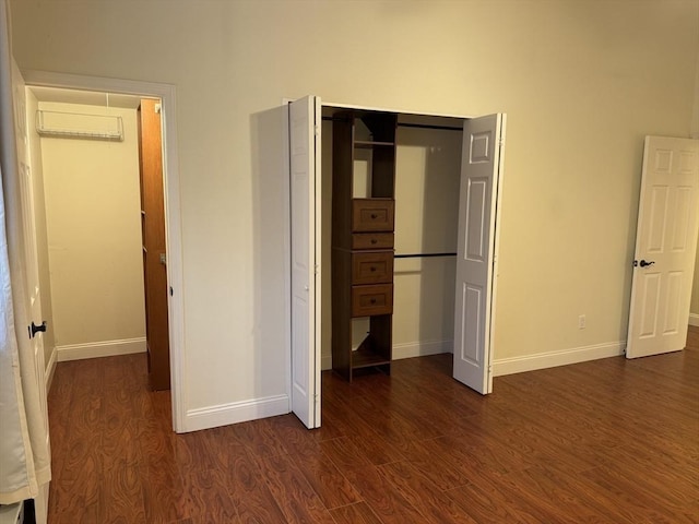 unfurnished bedroom with dark hardwood / wood-style floors