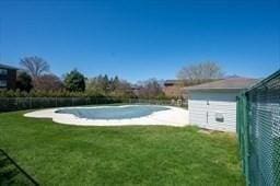 view of yard with an empty pool