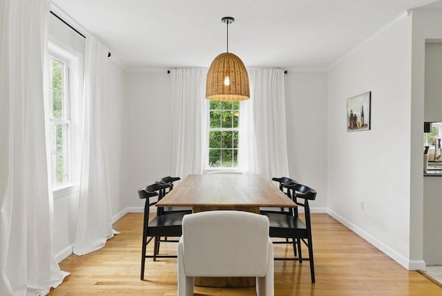 507 Towne St, North Attleboro, MA 02760 - dining area with light wood finished floors, baseboards, and ornamental molding