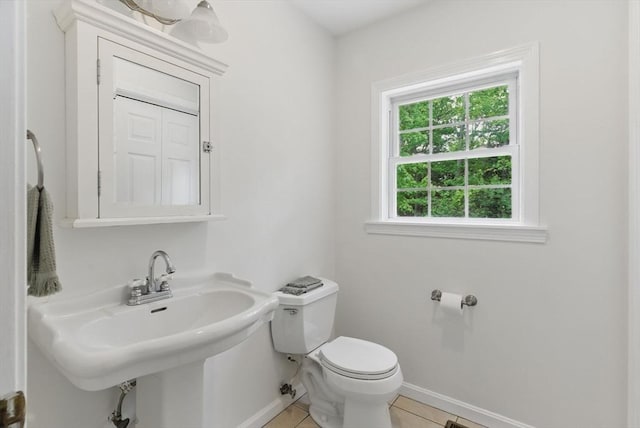 507 Towne St, North Attleboro, MA 02760 - half bath with toilet, baseboards, tile patterned floors, and a sink