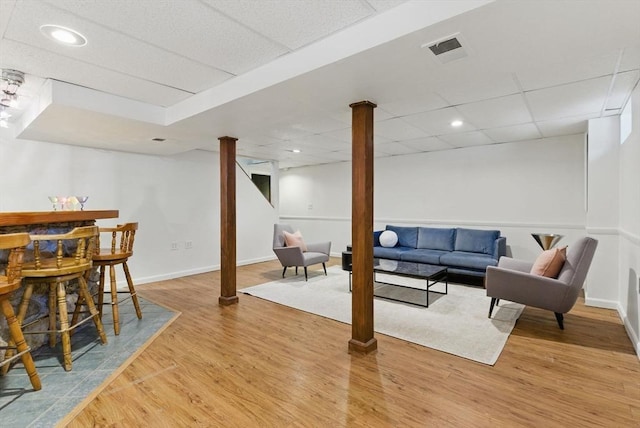 507 Towne St, North Attleboro, MA 02760 - living room with a drop ceiling, light wood finished floors, and baseboards
