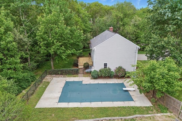 507 Towne St, North Attleboro, MA 02760 - view of swimming pool featuring a patio area, a diving board, and a view of trees