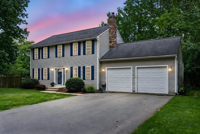 507 Towne St, North Attleboro, MA 02760 - colonial home with driveway, a chimney, and an attached garage
