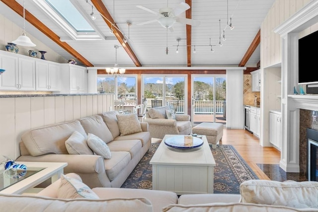 160 Waterway, Mashpee, MA 02649 - sunroom featuring rail lighting, a chandelier, plenty of natural light, and wine cooler