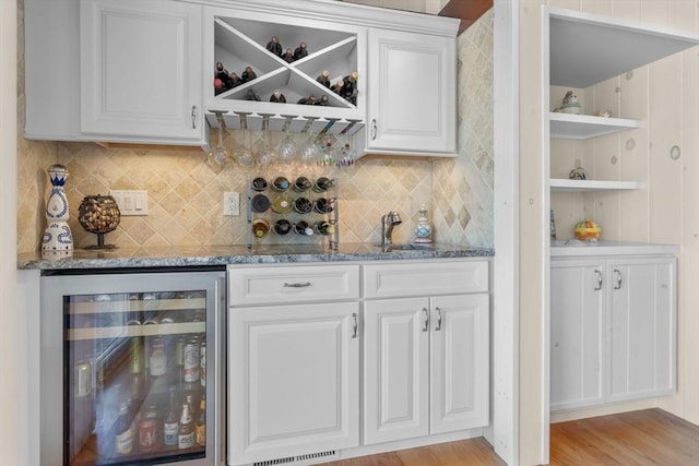 160 Waterway, Mashpee, MA 02649 - indoor dry bar featuring beverage cooler, backsplash, and light wood-type flooring