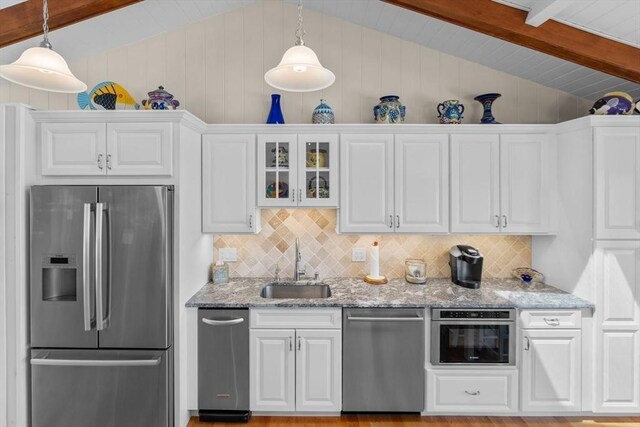 160 Waterway, Mashpee, MA 02649 - kitchen featuring stainless steel appliances, a sink, white cabinets, and tasteful backsplash