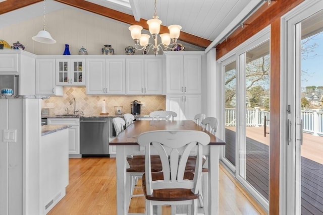 160 Waterway, Mashpee, MA 02649 - kitchen with stainless steel dishwasher, light wood-type flooring, decorative backsplash, and white cabinetry