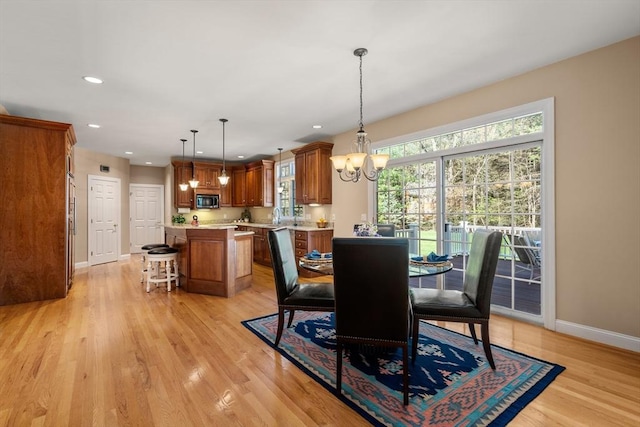 20 Peakham Rd, Sudbury, MA 01776 - dining area featuring baseboards, recessed lighting, a notable chandelier, and light wood-type flooring