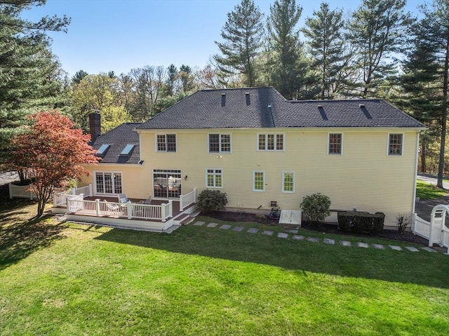 20 Peakham Rd, Sudbury, MA 01776 - rear view of house featuring a lawn, a wooden deck, and a chimney