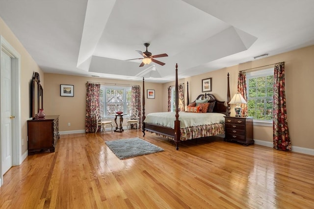 20 Peakham Rd, Sudbury, MA 01776 - bedroom with a ceiling fan, visible vents, a raised ceiling, baseboards, and light wood-style floors