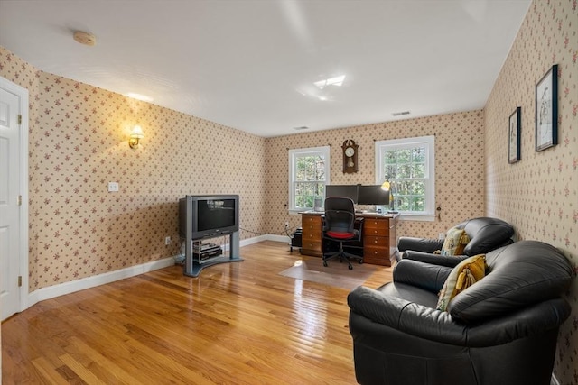 20 Peakham Rd, Sudbury, MA 01776 - home office with light wood-type flooring, baseboards, and wallpapered walls