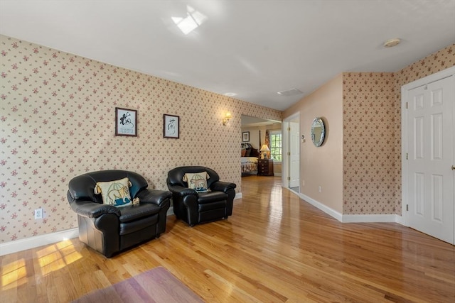 20 Peakham Rd, Sudbury, MA 01776 - living area with wallpapered walls, baseboards, and light wood-type flooring