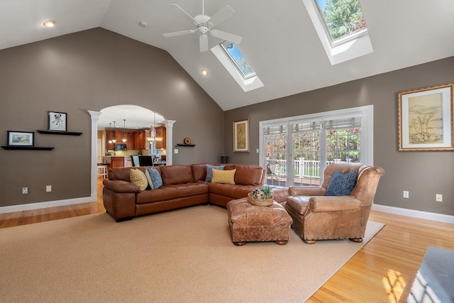 20 Peakham Rd, Sudbury, MA 01776 - living area with ornate columns, high vaulted ceiling, a ceiling fan, and light wood-style flooring