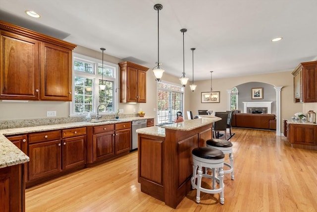 20 Peakham Rd, Sudbury, MA 01776 - kitchen featuring a sink, light wood-type flooring, open floor plan, and dishwasher