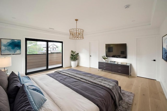 228 Auburn St Unit 228, Newton, MA 02466 - bedroom featuring access to exterior, a chandelier, and light wood-style floors