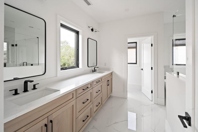 228 Auburn St Unit 228, Newton, MA 02466 - bathroom featuring double vanity, healthy amount of natural light, a marble finish shower, and marble finish floors
