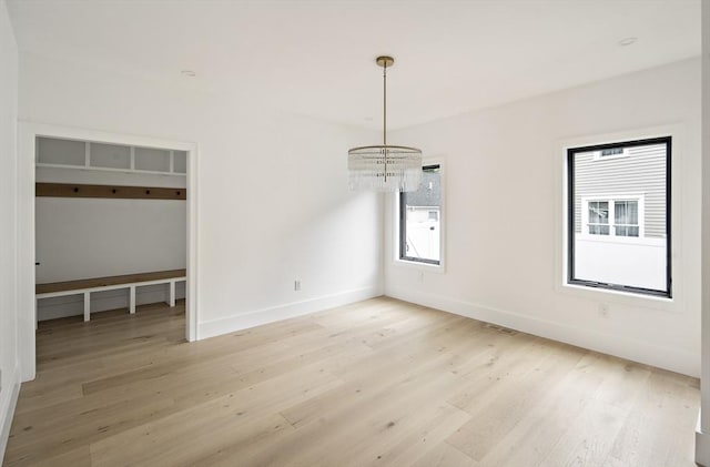 228 Auburn St Unit 228, Newton, MA 02466 - unfurnished dining area with a chandelier and light wood-style floors