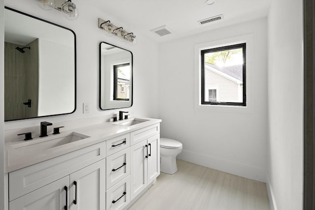 228 Auburn St Unit 228, Newton, MA 02466 - bathroom with double vanity and plenty of natural light