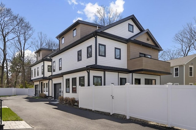 228 Auburn St Unit 228, Newton, MA 02466 - view of home's exterior featuring a balcony and driveway