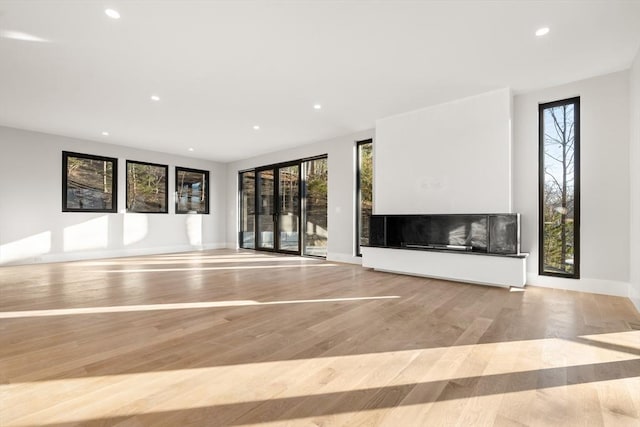 unfurnished living room featuring light hardwood / wood-style floors