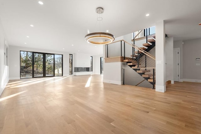 unfurnished living room with light hardwood / wood-style floors