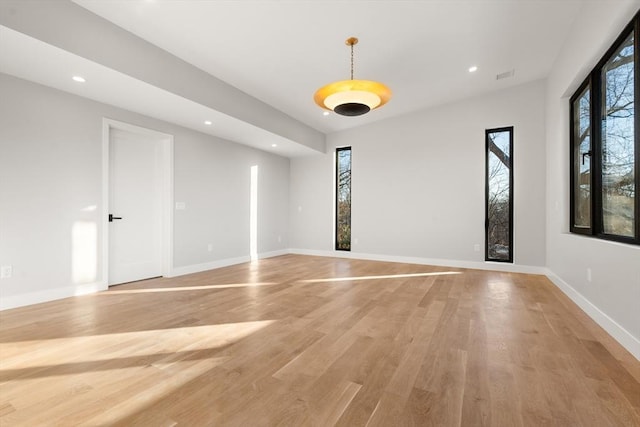 spare room with light wood-type flooring