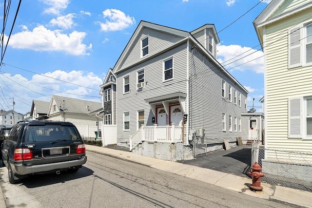 neoclassical home with cooling unit
