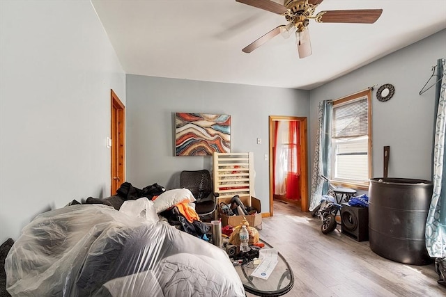 bedroom with ceiling fan and wood finished floors