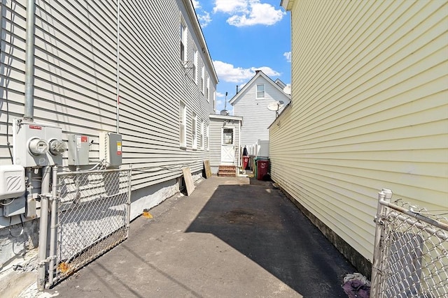 view of property exterior featuring fence