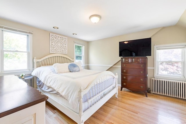 273 Greendale Ave, Needham, MA 02494 - bedroom with radiator heating unit, light wood-type flooring, and lofted ceiling