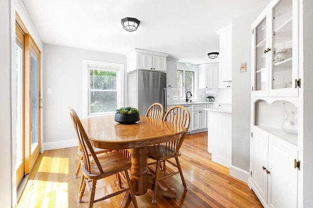 273 Greendale Ave, Needham, MA 02494 - dining room featuring plenty of natural light, light wood finished floors, and baseboards