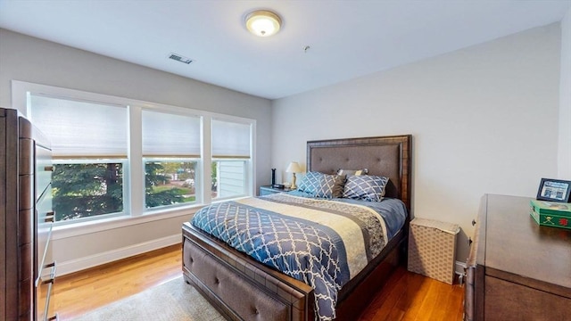 1100 Vfw Pkwy Unit 202, Boston, MA 02132 - bedroom with wood finished floors and baseboards
